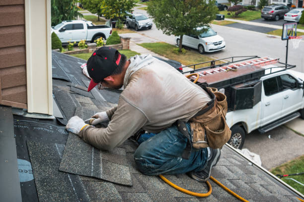 Professional Storm Damage Roof Repair technician working in Mechanicsburg, IL